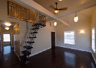 The livingroom with hall to the left, front door to the right and loft ladder .jpg